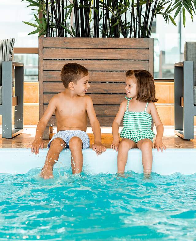 Kids at indoor pool at Four Seasons Hotel Boston