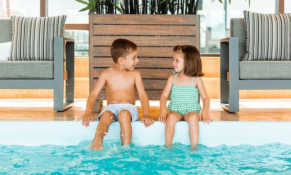 Kids at indoor pool at Four Seasons Hotel Boston