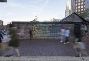 Boston sign over a wall outside City Hall Plaza