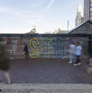 Boston sign over a wall outside City Hall Plaza