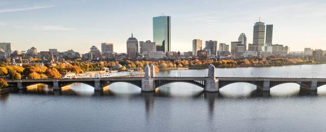 An aerial view of the Charles River with Boston in the background