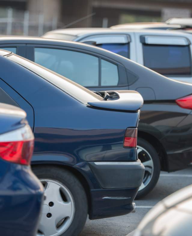 Several cars in a parking lot
