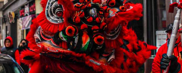 Large Red Dragon Puppet in Street During Chinese New Year Celebration in Boston