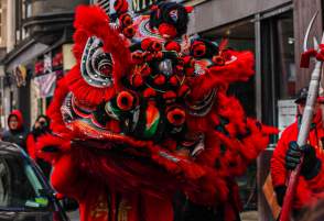 Large Red Dragon Puppet in Street During Chinese New Year Celebration in Boston