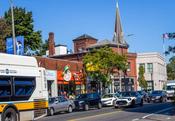 Busy street lined with cars in Jamaica Plain
