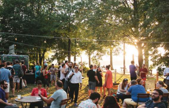 A Crowd At Owl's Nest Beer Garden In Boston, MA