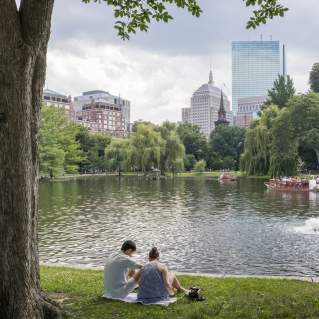 Two people picnicking on the Public Garden