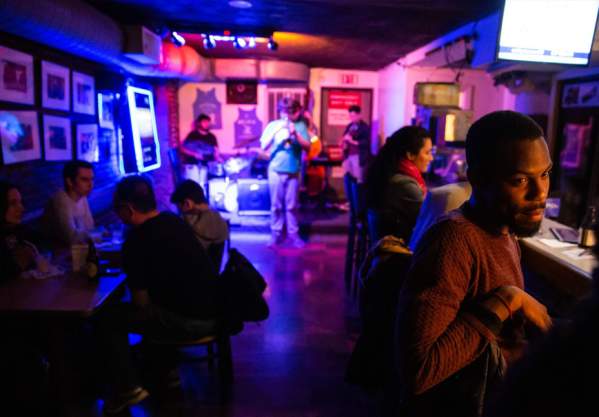 People enjoying live music at wally's cafe Jazz club.
