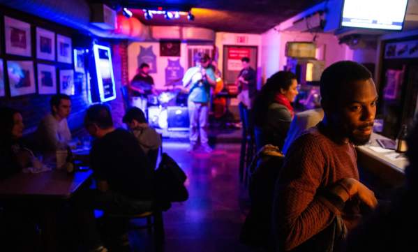People enjoying live music at wally's cafe Jazz club.